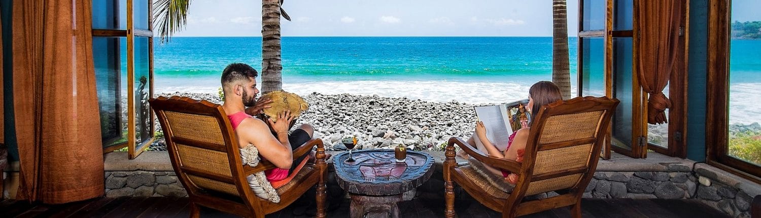 Real Estate in Riviera Nayarit Mexico - image of young couple looking out window at the ocean