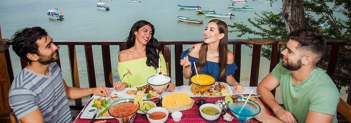 Dining in Riviera Nayarit Mexico - image of 2 couples dining on restaurant balcony by the beach