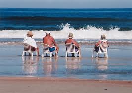 Four people in lawn chairs in the water in Riviera Nayarit MX