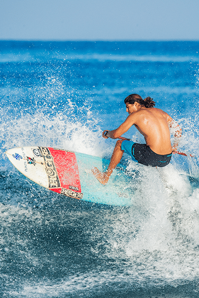 Surfer getting airborne on his board