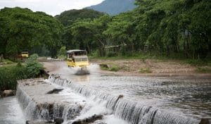 Mercedes off road 4x4 trucks crossing a river in Riviera Nayarit