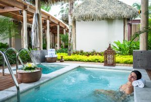 Woman soaking in spa hot tub at Vidanta Hotel in Nuevo Vallarta Riviera Nayarit Mexico