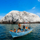 People in a boat watching birds over an island in Riviera Nayarit