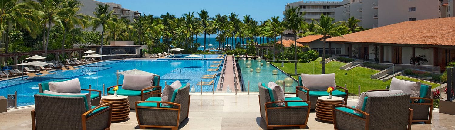 Pool and deck with chairs at Reflect Hotel in Riviera Nayarit