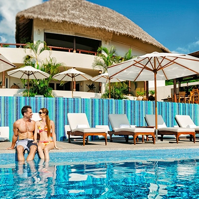 matlali Young couple sitting at the pool at Grand Matlali Hills Resort & Spa